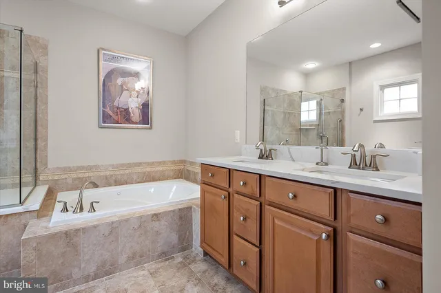 a front view of a house with swimming pool and sitting area