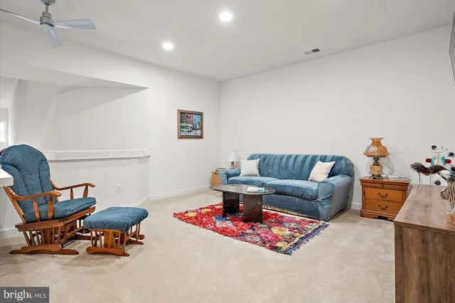 an aerial view of a house with a garden and lake view
