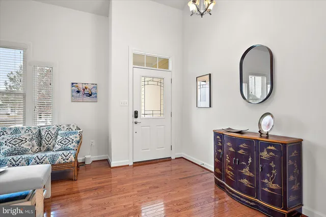 a living room with fireplace furniture and a wooden floor