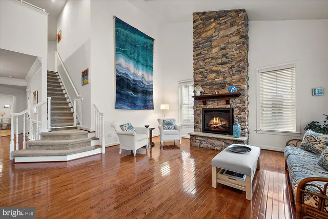 a view of a dining room with lots of furniture and wooden floor