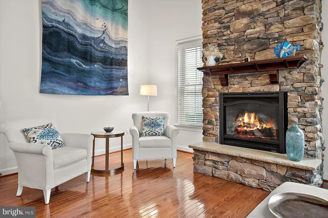 a view of a dining room with furniture wooden floor and a chandelier