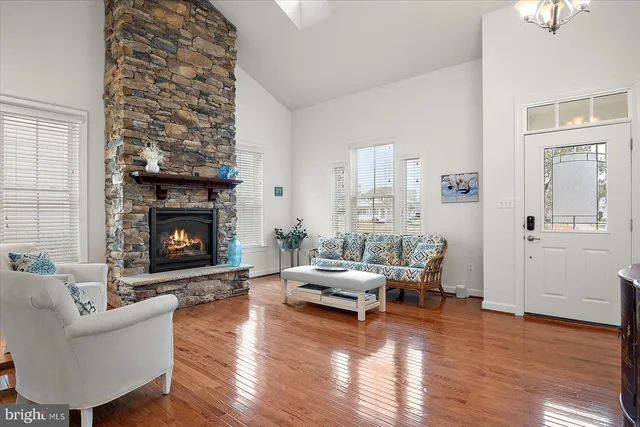 a kitchen with granite countertop stainless steel appliances a stove a sink and cabinets