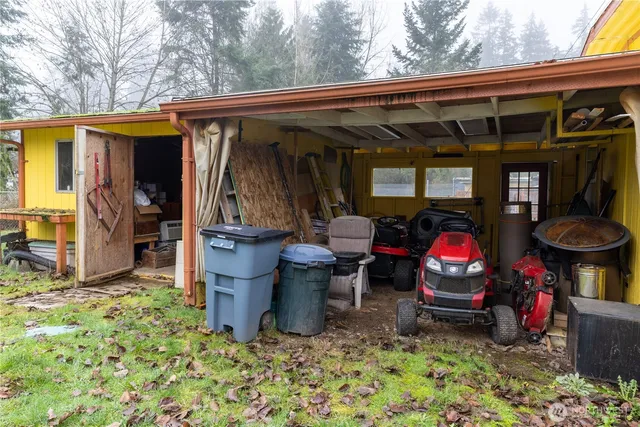 a view of two chairs in a patio