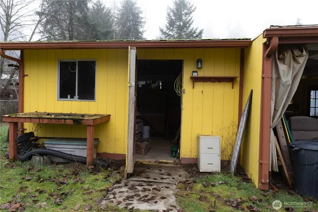a side view of a house with a yard
