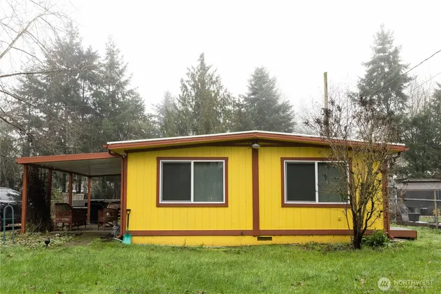 a view of outdoor space yard and front view of house