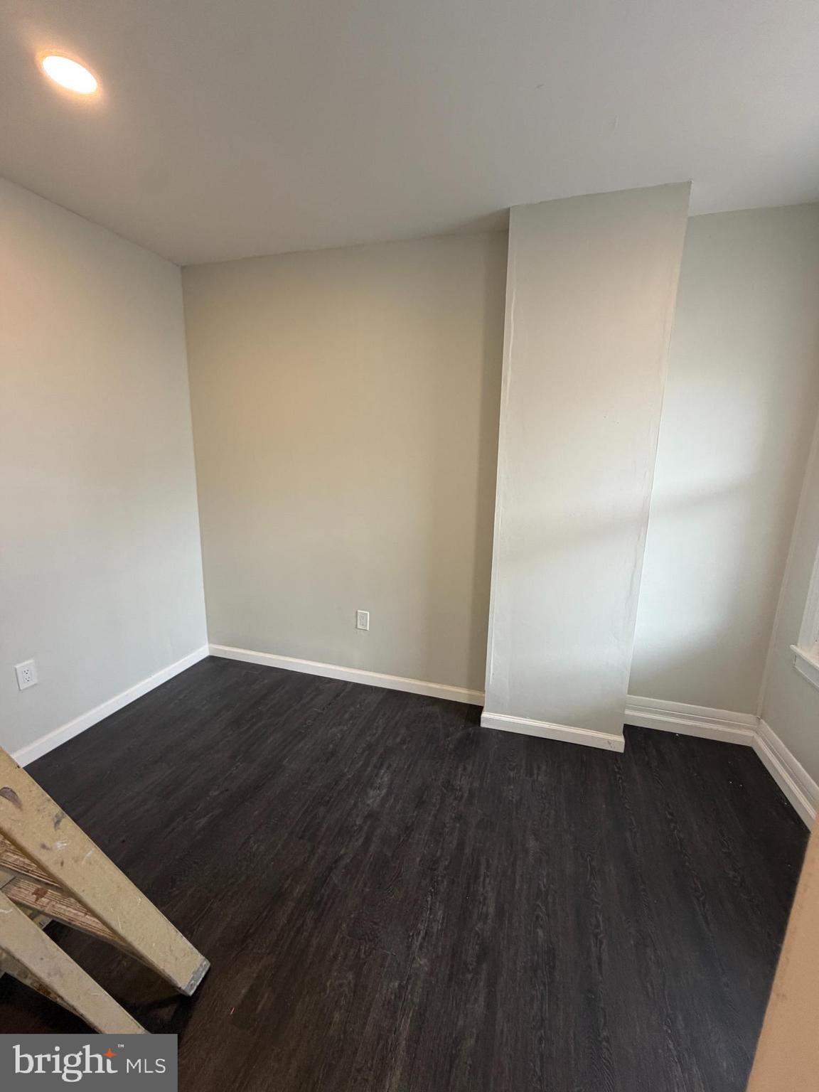 3760 North 9th Street Philadelphia, PA 19140 - Photo 11 of 17 a view of an empty room with wooden floor