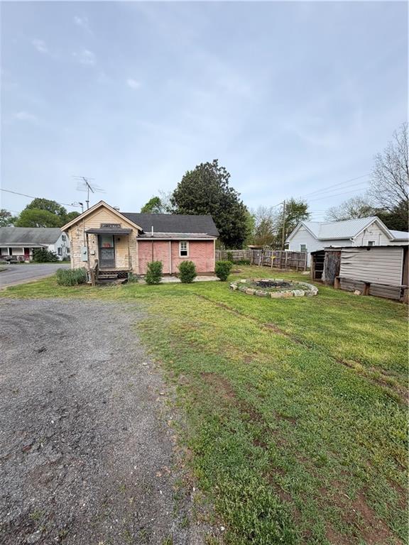3 Walnut Street Aragon, GA 30104 - Photo 10 of 10 a view of a house with a big yard and large trees