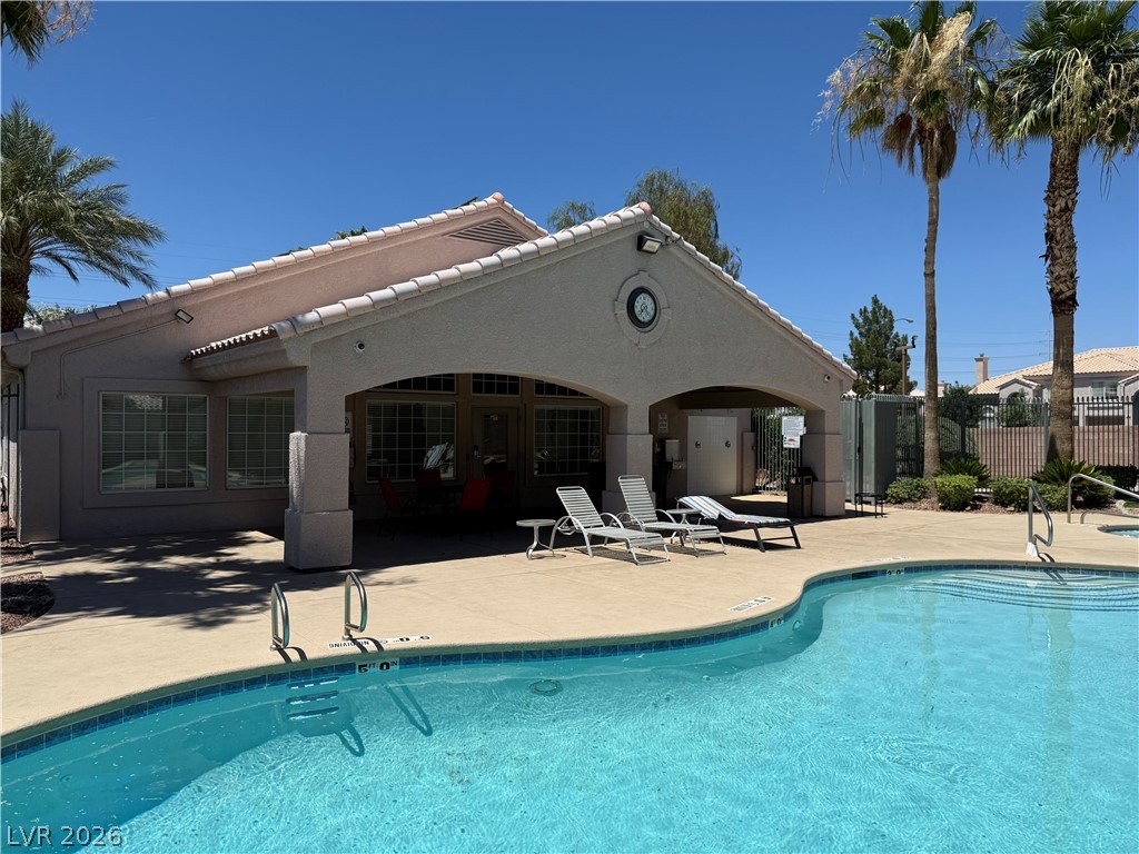 517 Crumpler Place Henderson, NV 89052 - Photo 2 of 9 A sparkling pool invites relaxation next to a well-appointed clubhouse.