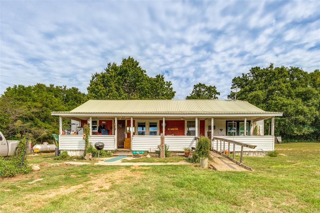 1549 Starr Road Denison, TX 75021 - Photo 2 of 13 a view of a large body of house with swimming pool and next to a yard