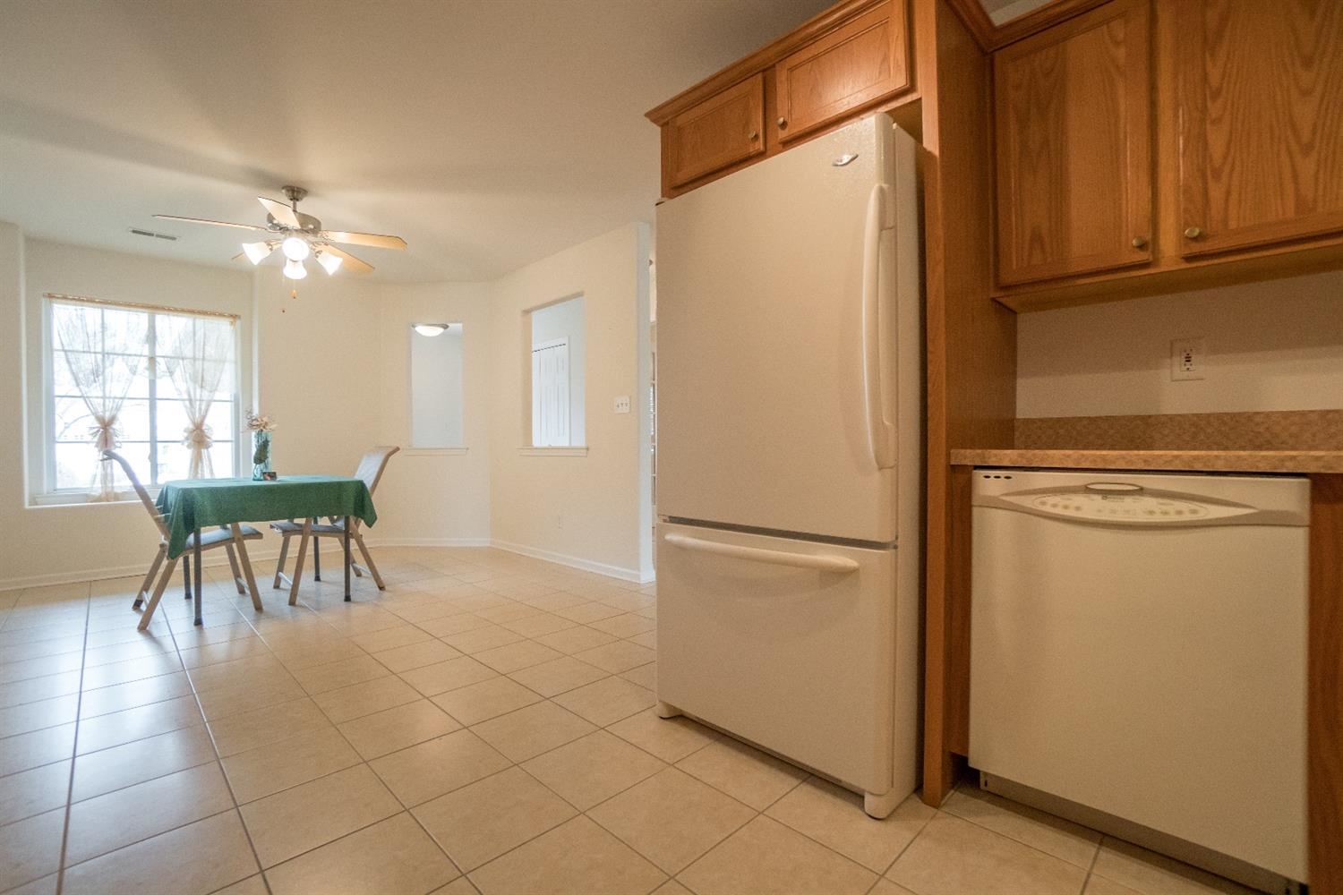 10647 Keystone Lane Crown Point, IN 46307 - Photo 7 of 10 a view of kitchen with furniture and a refrigerator