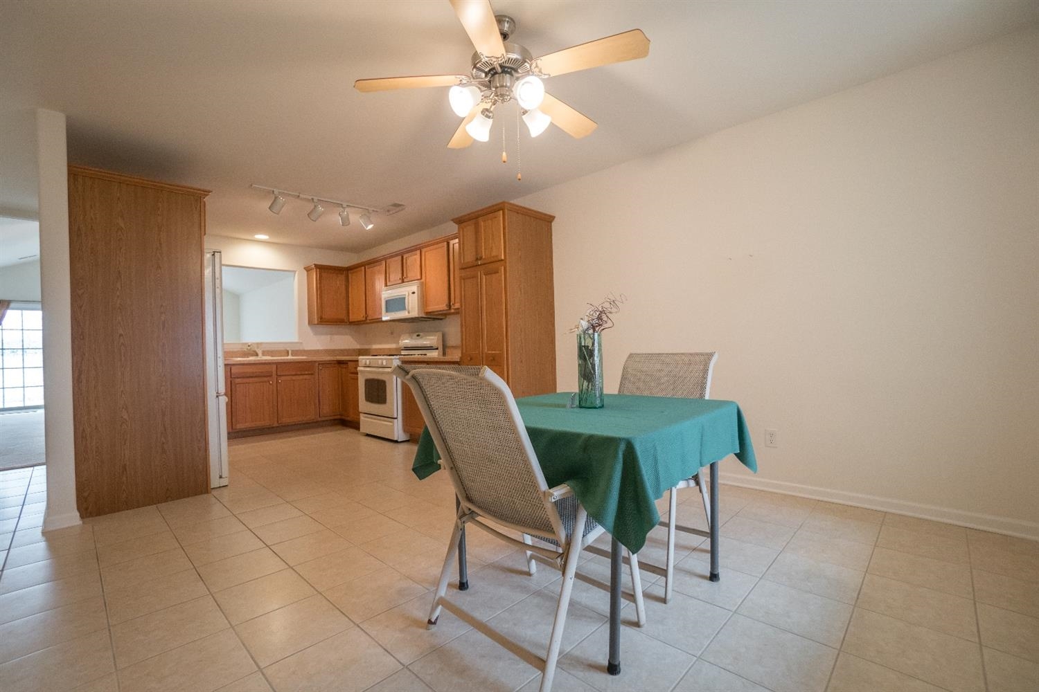 10647 Keystone Lane Crown Point, IN 46307 - Photo 8 of 10 a view of a dining room with furniture and a chandelier fan