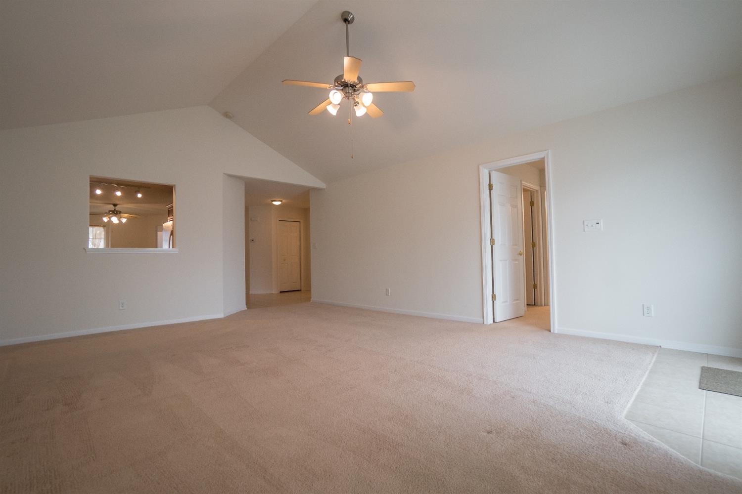 10647 Keystone Lane Crown Point, IN 46307 - Photo 10 of 10 a view of an empty room with a chandelier fan