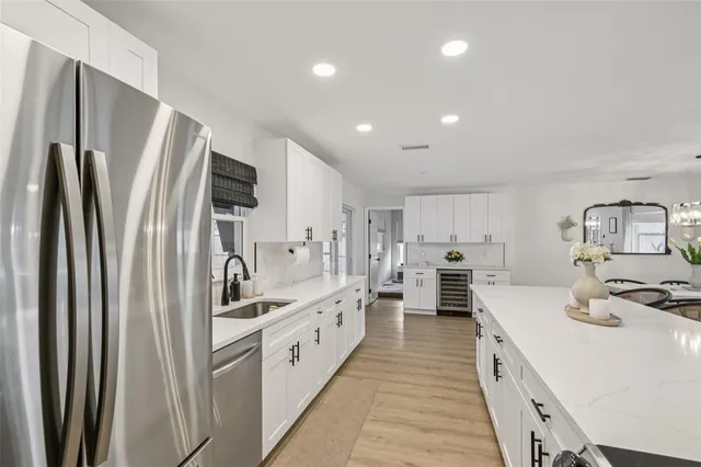 a bedroom with a bed a ceiling fan and a dresser
