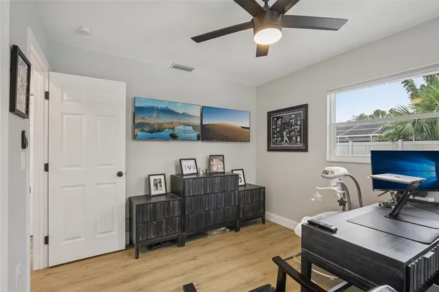 a bedroom with a bed and a desk