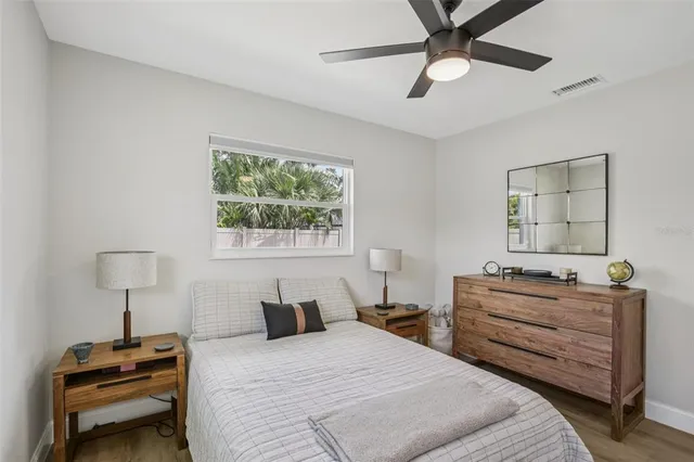 a bedroom with a bed and a dresser