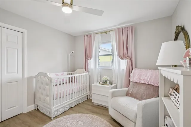 a living room with furniture a bed and a large window