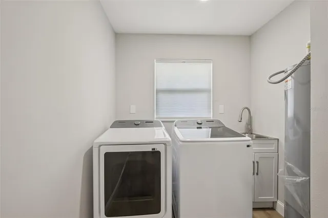 a view of a kitchen with a stove top oven