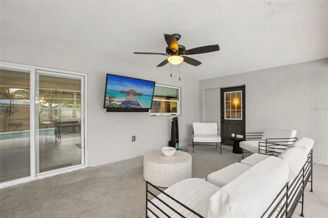 a living room with patio and a couch