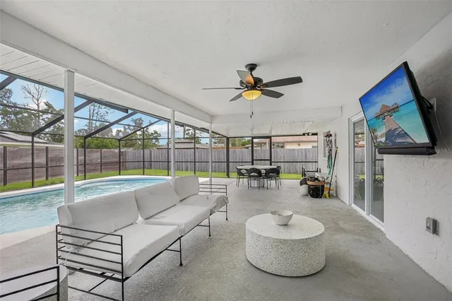 a dining room with furniture and a garden
