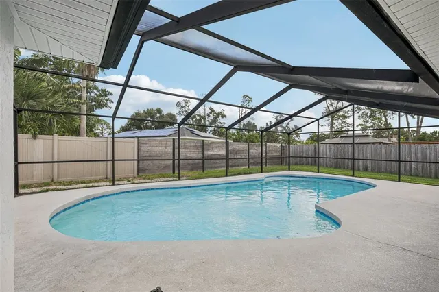 a view of a swimming pool with a patio