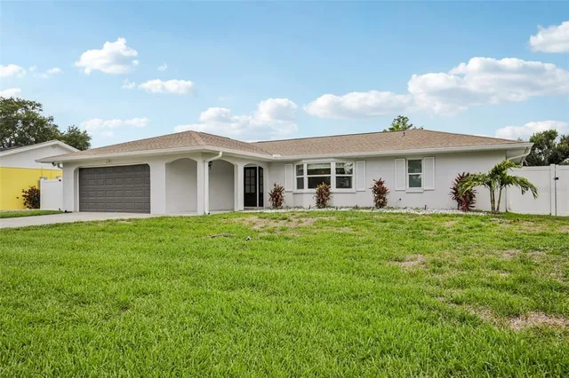 a front view of house with yard and seating area