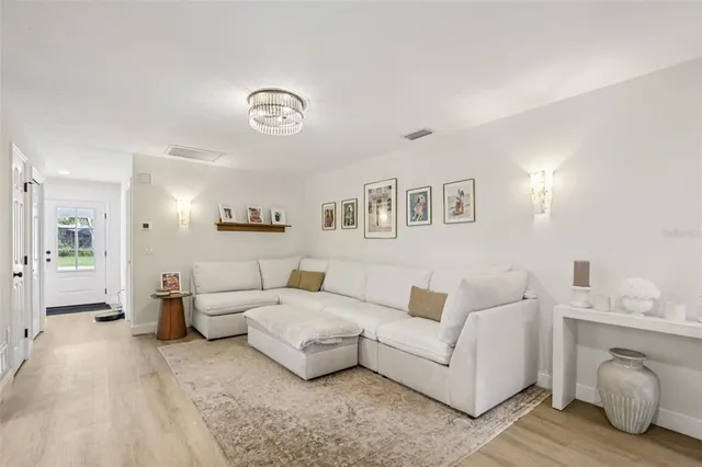 a living room with furniture and a table