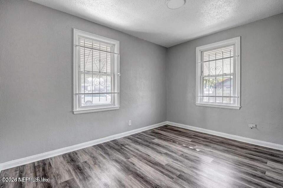 1804 Cleveland Street Jacksonville, FL 32209 - Photo 17 of 25 a view of a room with wooden floor and windows