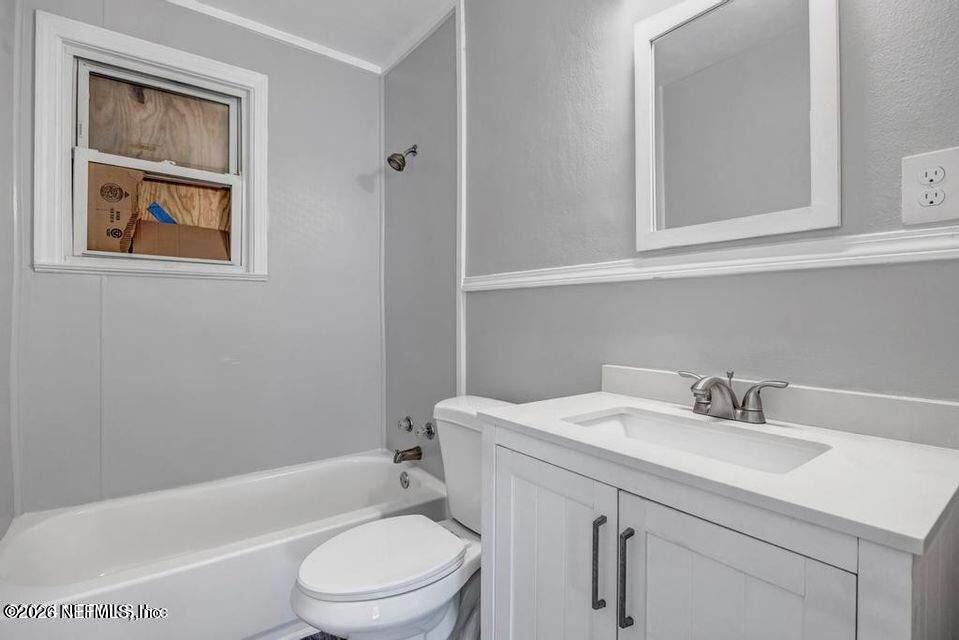 1804 Cleveland Street Jacksonville, FL 32209 - Photo 21 of 25 a bathroom with a sink toilet and shower