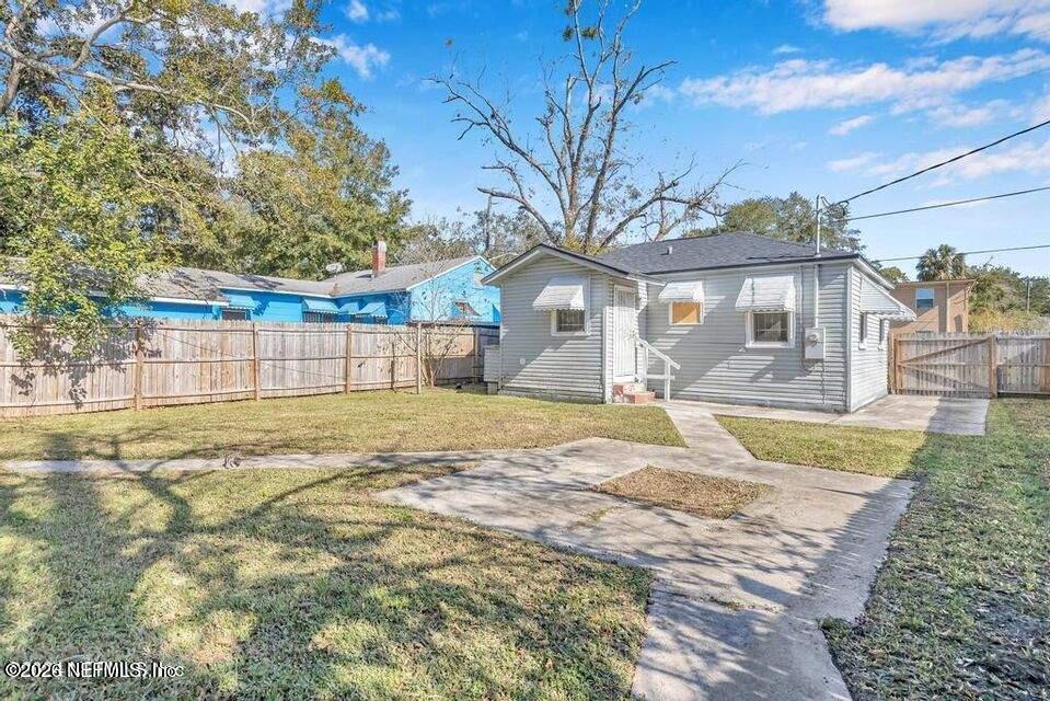 1804 Cleveland Street Jacksonville, FL 32209 - Photo 24 of 25 a view of a house with a backyard and a tree
