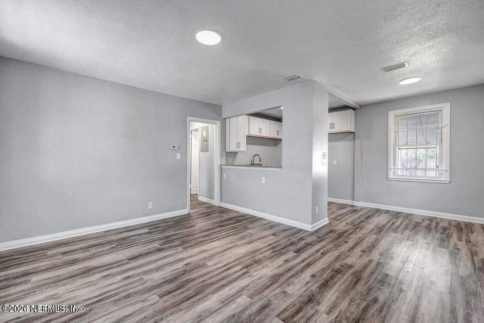 1804 Cleveland Street Jacksonville, FL 32209 - Photo 5 of 25 a view of a kitchen with wooden floor and a kitchen