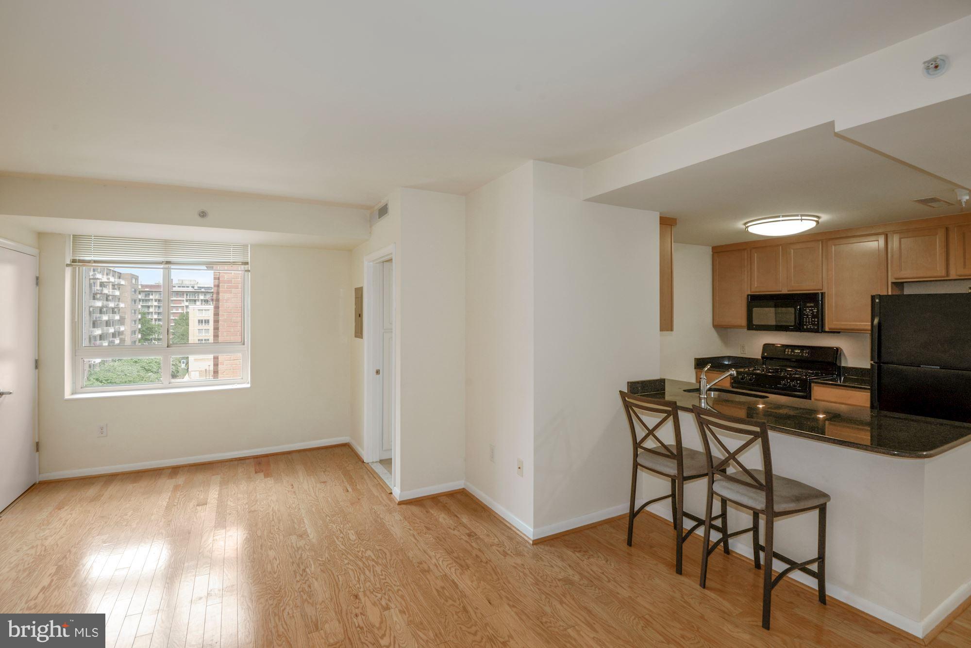 355 I Street Southwest, Unit S607 Washington, DC 20024 - Photo 11 of 27 a view of a workspace with furniture and a window
