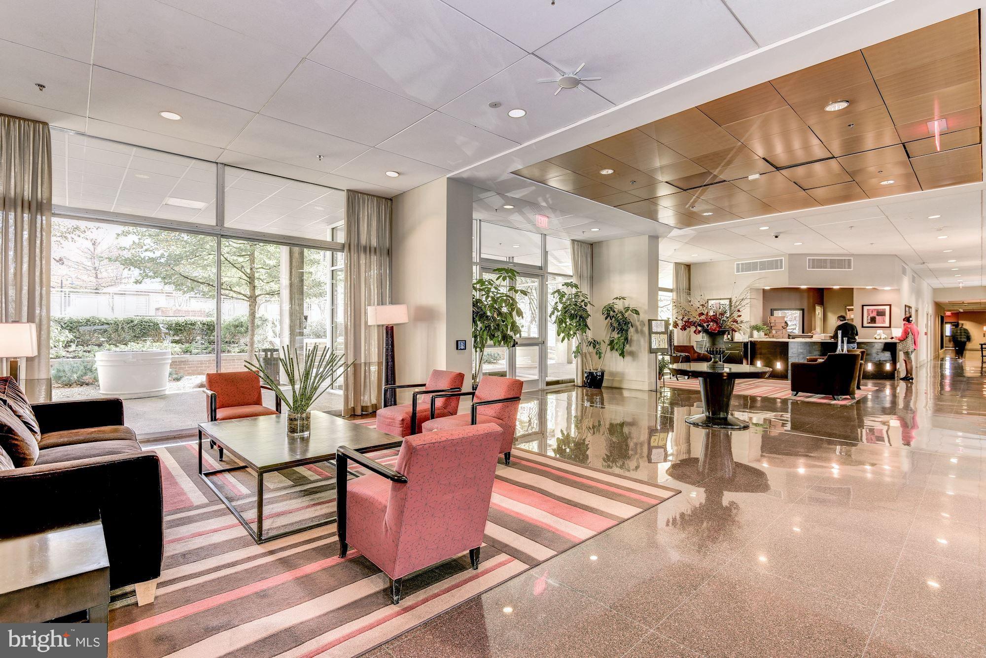355 I Street Southwest, Unit S607 Washington, DC 20024 - Photo 19 of 27 a living room with lots of furniture and a large window