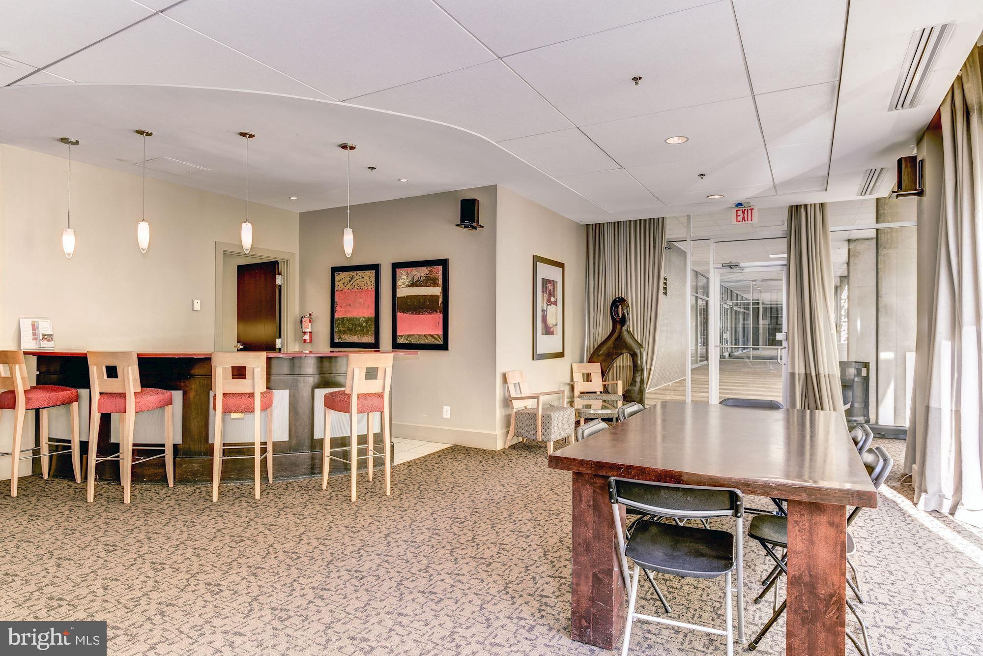 355 I Street Southwest, Unit S607 Washington, DC 20024 - Photo 21 of 27 a living room with lots of furniture and a wooden floor
