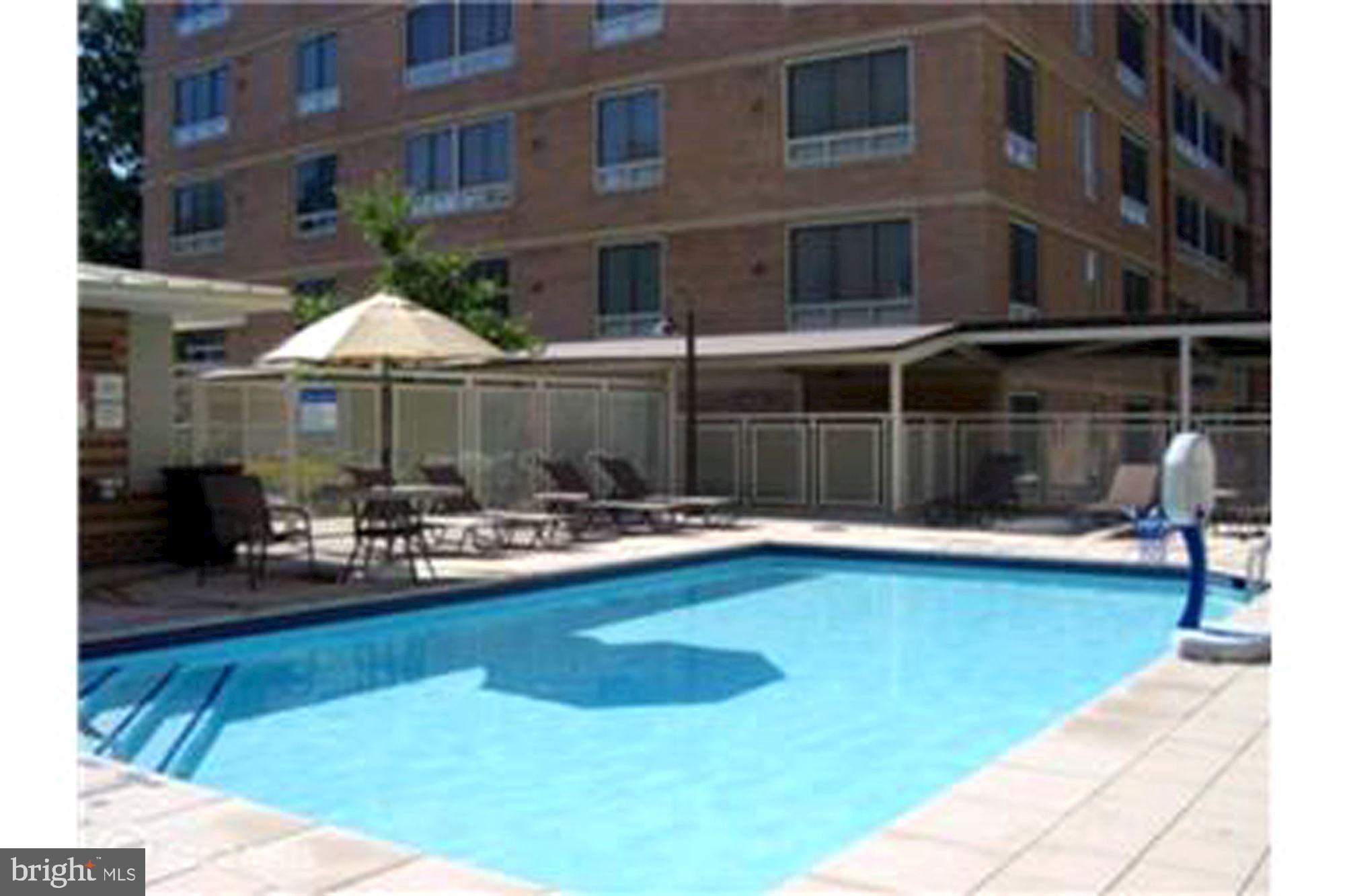 355 I Street Southwest, Unit S607 Washington, DC 20024 - Photo 24 of 27 a view of a house with a swimming pool and sitting area