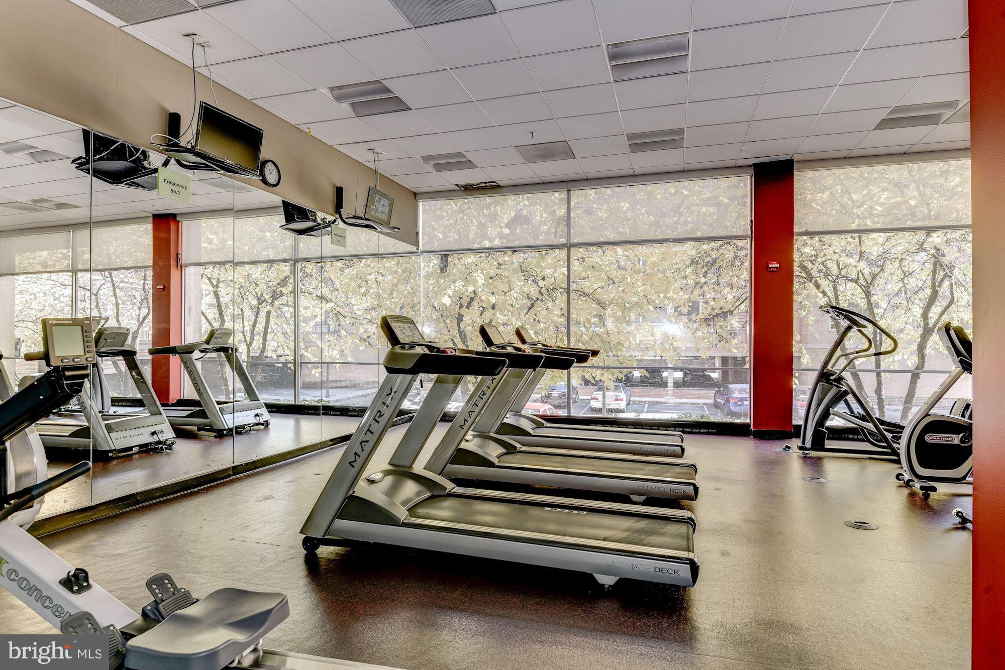 355 I Street Southwest, Unit S607 Washington, DC 20024 - Photo 25 of 27 a room with gym equipment and a large window