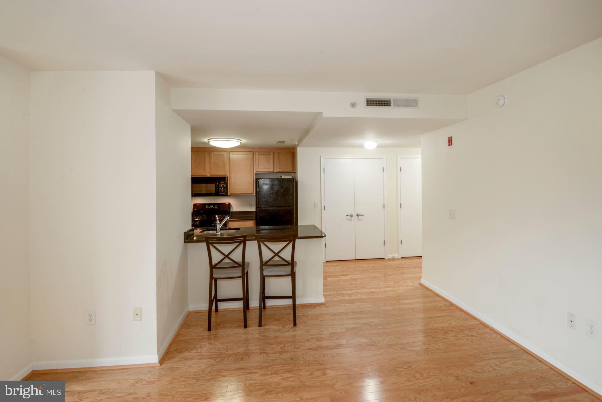 355 I Street Southwest, Unit S607 Washington, DC 20024 - Photo 7 of 27 a view of kitchen with furniture and a window