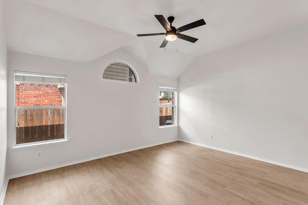 447 Trinity Drive Allen, TX 75002 - Photo 18 of 24 wooden floor in an empty room with a window
