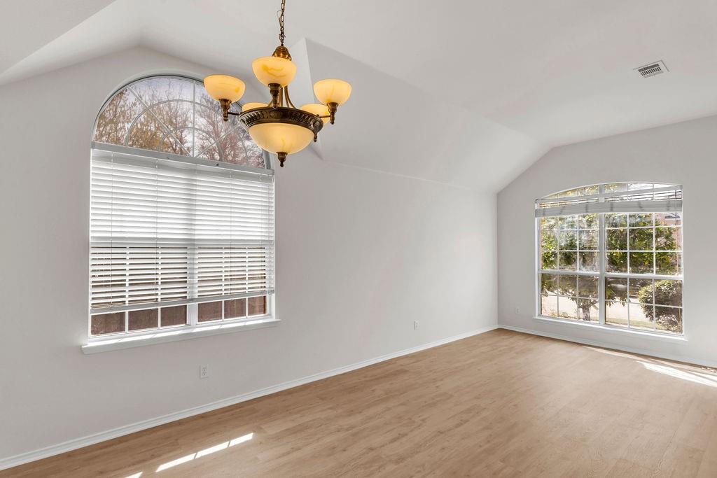 447 Trinity Drive Allen, TX 75002 - Photo 5 of 24 a window in a room with a chandelier
