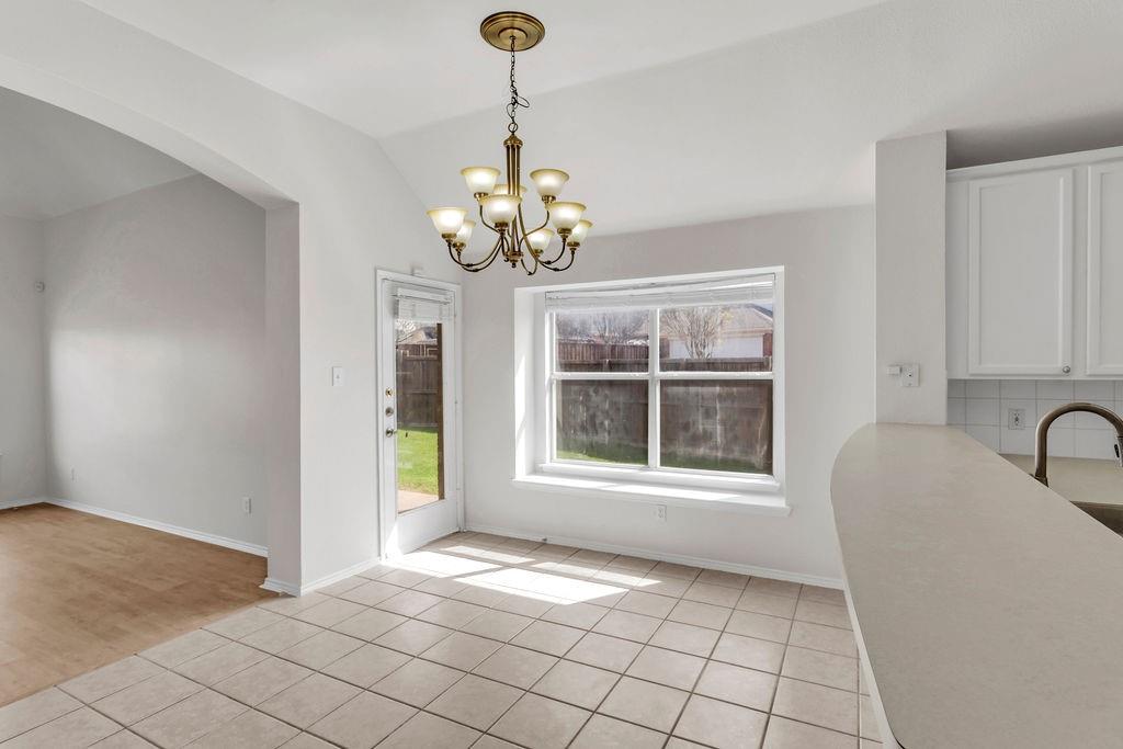 447 Trinity Drive Allen, TX 75002 - Photo 9 of 24 a view of an empty room with a window