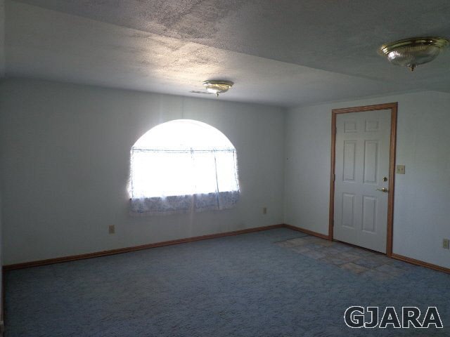 989 17 Road Fruita, CO 81521 - Photo 16 of 23 an empty room with a window