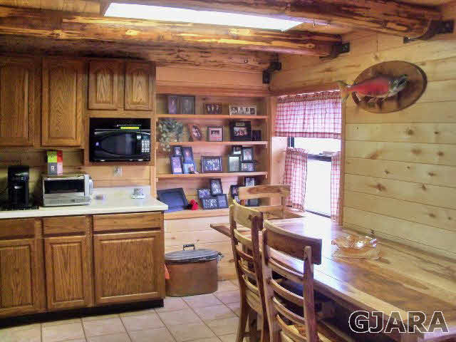 989 17 Road Fruita, CO 81521 - Photo 2 of 23 a kitchen with a sink and cabinets