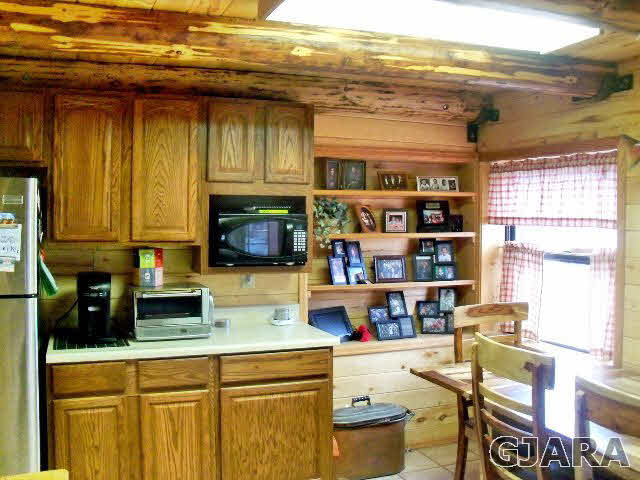 989 17 Road Fruita, CO 81521 - Photo 6 of 23 a kitchen with a refrigerator and a sink