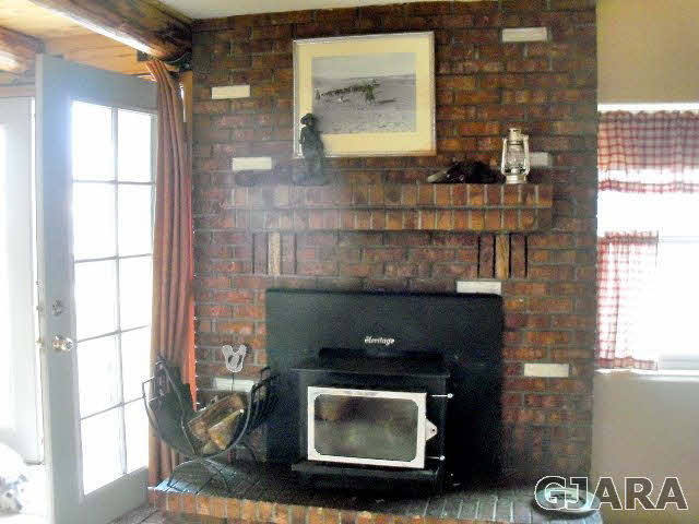 989 17 Road Fruita, CO 81521 - Photo 8 of 23 a room with a fireplace