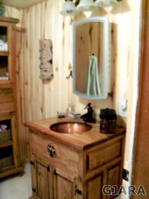 989 17 Road Fruita, CO 81521 - Photo 9 of 23 a bathroom with a sink and a mirror