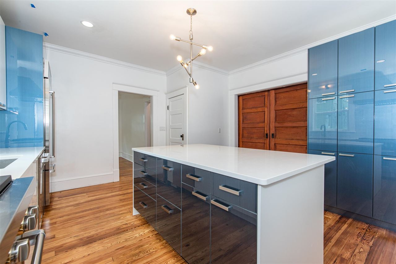 21 Saragossa Street St. Augustine, FL 32084 - Photo 14 of 46 a room with a chandelier and a dresser