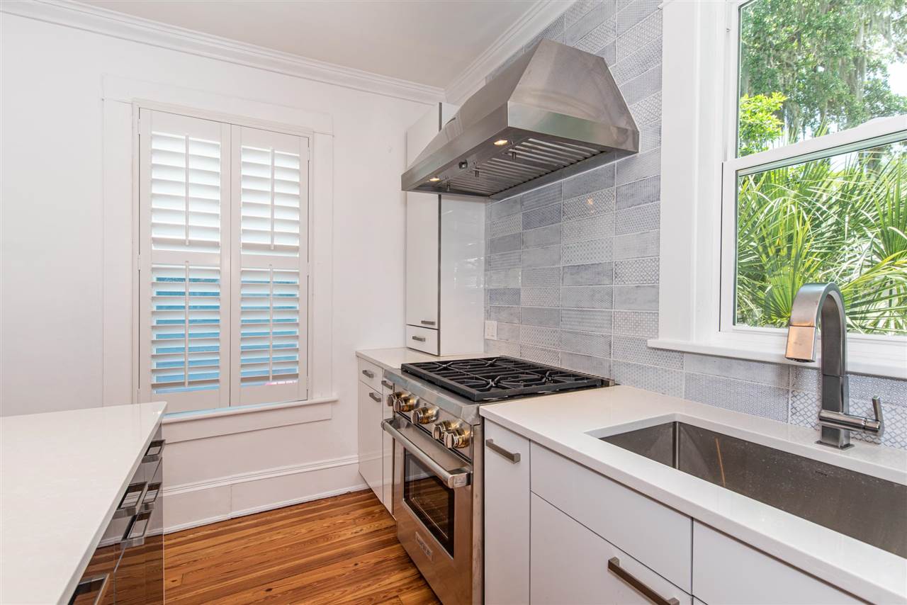 21 Saragossa Street St. Augustine, FL 32084 - Photo 17 of 46 a kitchen that has a stove and a window