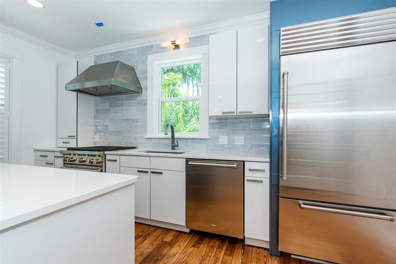 21 Saragossa Street St. Augustine, FL 32084 - Photo 19 of 46 a kitchen with stainless steel appliances granite countertop a sink a stove and a refrigerator