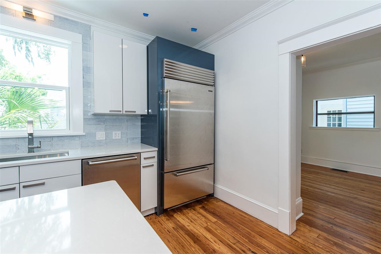 21 Saragossa Street St. Augustine, FL 32084 - Photo 20 of 46 a kitchen with granite countertop stainless steel appliances a refrigerator sink and window