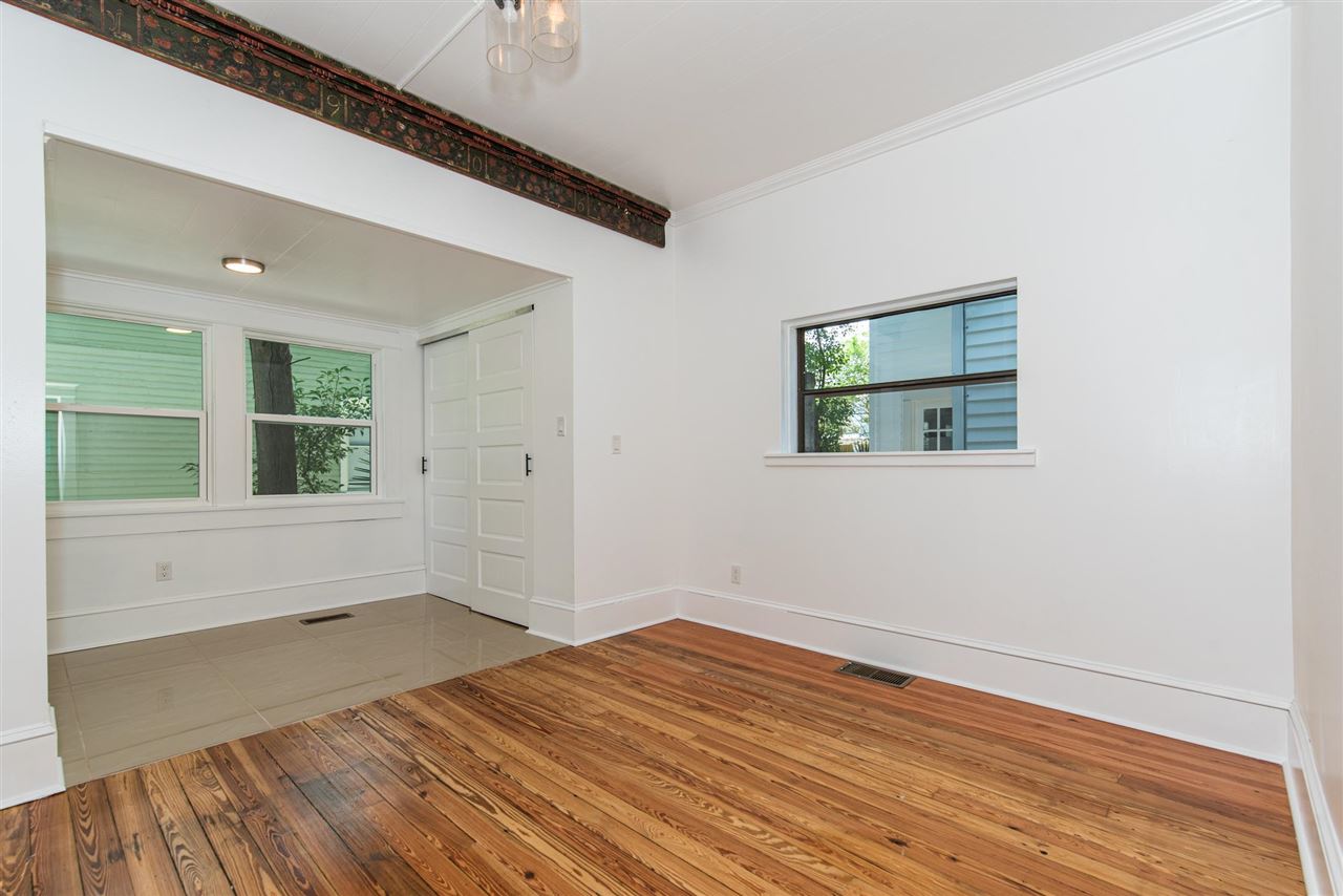 21 Saragossa Street St. Augustine, FL 32084 - Photo 21 of 46 a view of empty room with wooden floor and fan