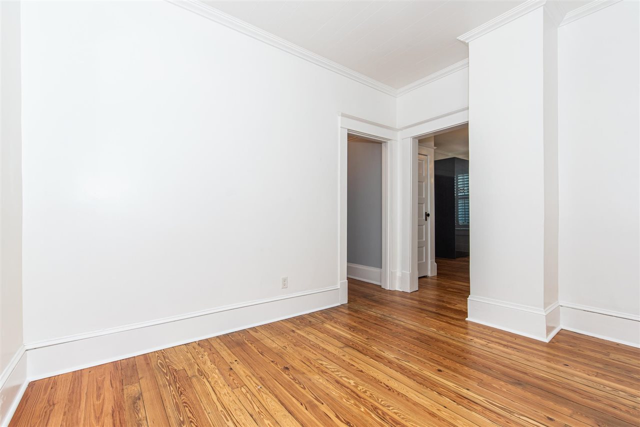 21 Saragossa Street St. Augustine, FL 32084 - Photo 24 of 46 a view of an empty room with wooden floor